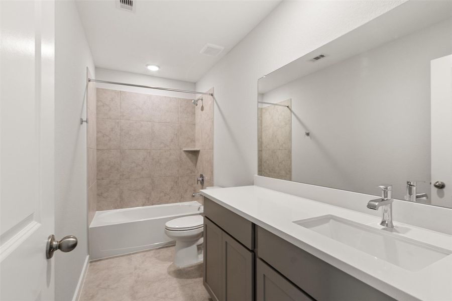 Furnished interior view inside a new home in Sunterra, Katy (Image 8).