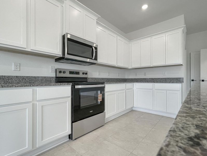 Furnished interior view inside a new home in Harmony Central, St. Cloud (Image 6).