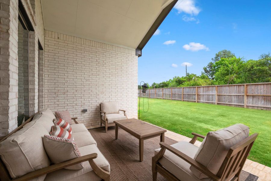 Step outside to enjoy the expansive backyard, complete with a large covered patio — the perfect setup for outdoor dining, lounging, or weekend barbecues. It connects to the main living area for easy entertaining! Step outside to enjoy the expansive backyard, complete with a large covered patio — the perfect setup for outdoor dining, lounging, or weekend barbecues. It connects to the main living area for easy entertaining!