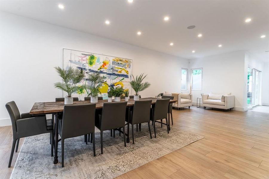 Dining space with light wood-type flooring Dining space with light wood-type flooring