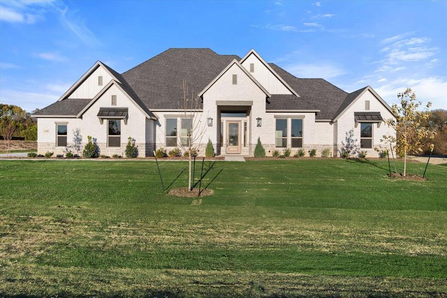 View of front of house with a front lawn