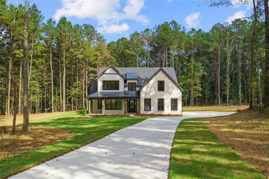 Front exterior of a new home in , Jenkinsburg, GA, highlighting curb appeal (Image 1).