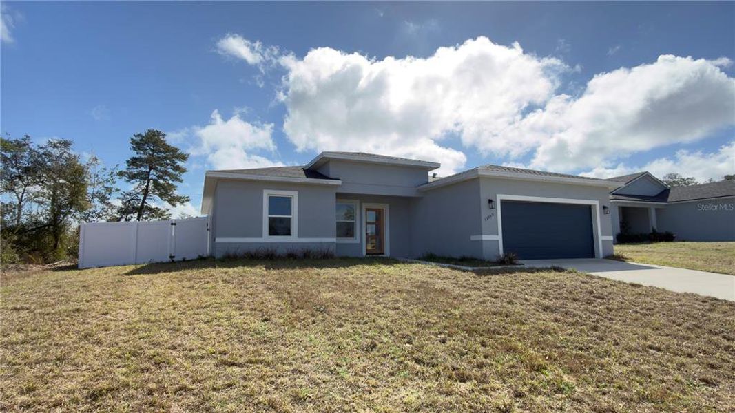 Front exterior of a new home in , Ocala, FL, highlighting curb appeal (Image 22). Front exterior of a new home in , Ocala, FL, highlighting curb appeal (Image 22).