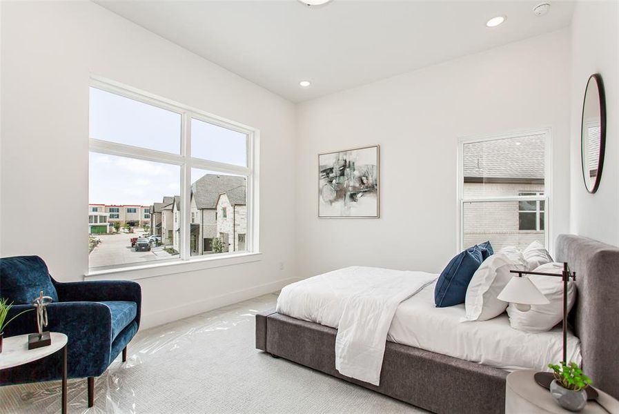 Bedroom with light colored carpet