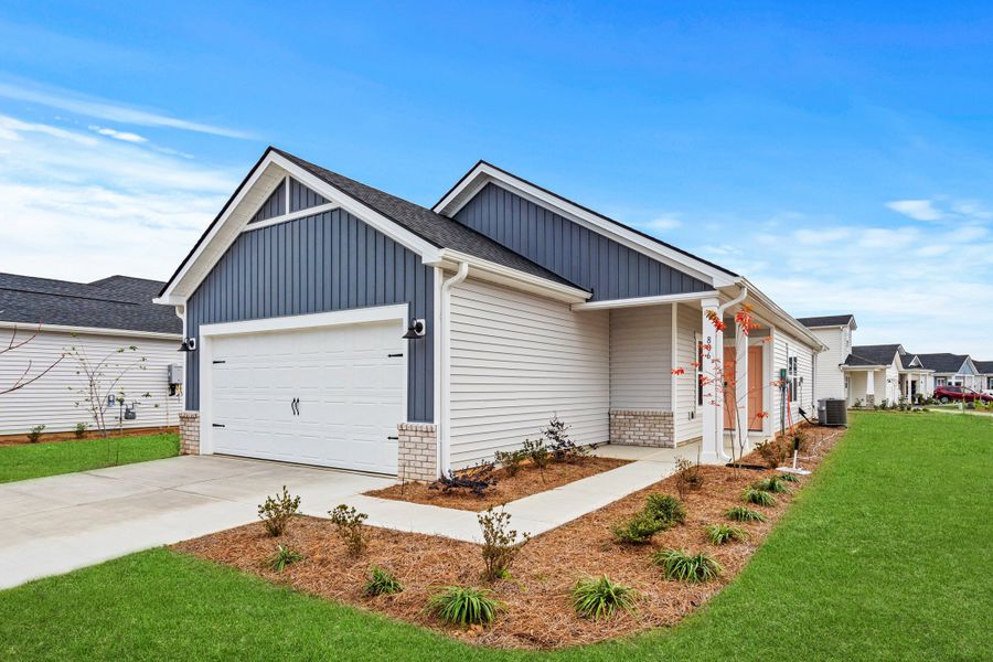 Front exterior of a new home in Waterside, Longs, SC, highlighting curb appeal (Image 2). Front exterior of a new home in Waterside, Longs, SC, highlighting curb appeal (Image 2).