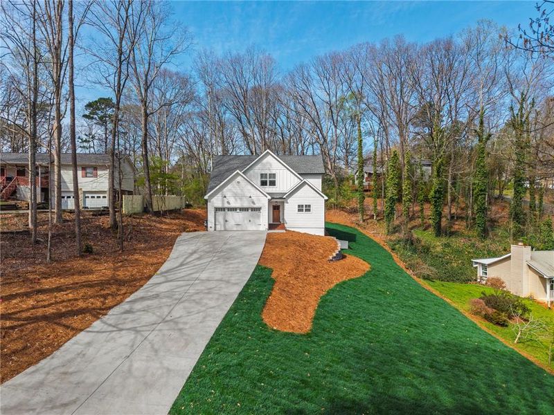 Front exterior of a new home in , Woodstock, GA, highlighting curb appeal (Image 18).