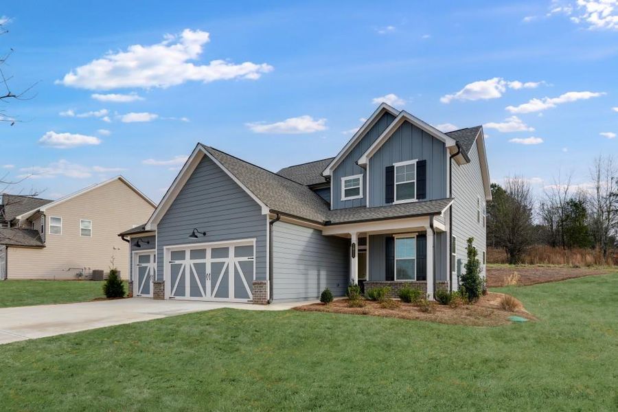 Front exterior of a new home in Wellington Estates, Madison, GA, highlighting curb appeal (Image 21).