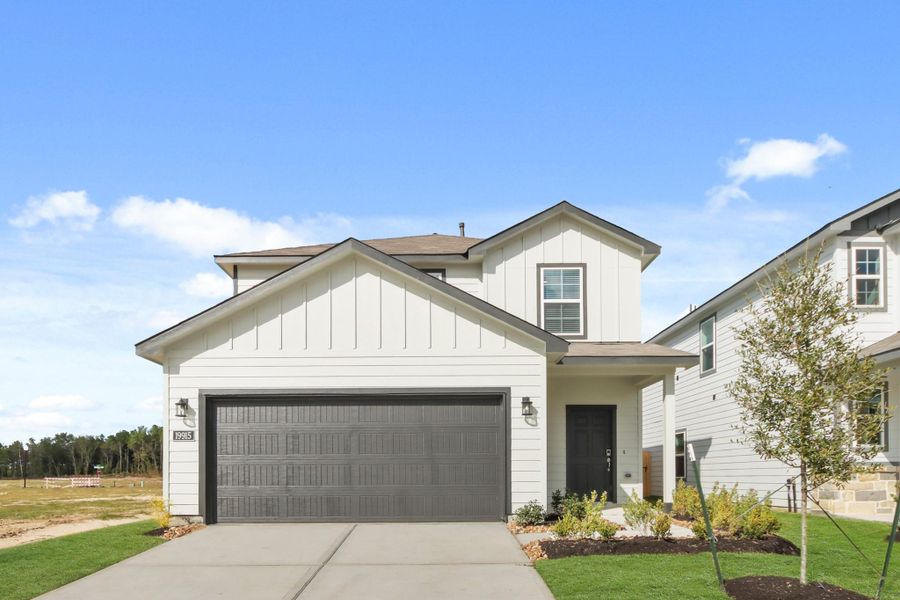 Front exterior of a new home in Northpark South, Porter, TX, highlighting curb appeal (Image 1). Front exterior of a new home in Northpark South, Porter, TX, highlighting curb appeal (Image 1).