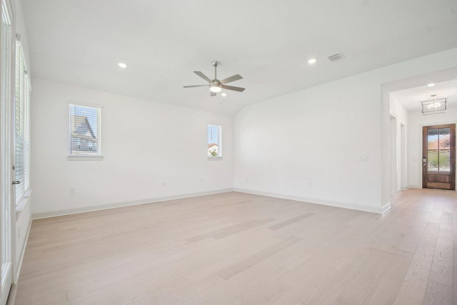 Empty room featuring light wood-style flooring, recessed lighting, and ceiling fan Empty room featuring light wood-style flooring, recessed lighting, and ceiling fan