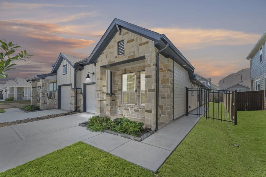 Representative exterior photo of a completed home built from the Carriagehouse by Chesmar Homes in Meridiana Townhomes, Iowa Colony, TX (Image 32).
