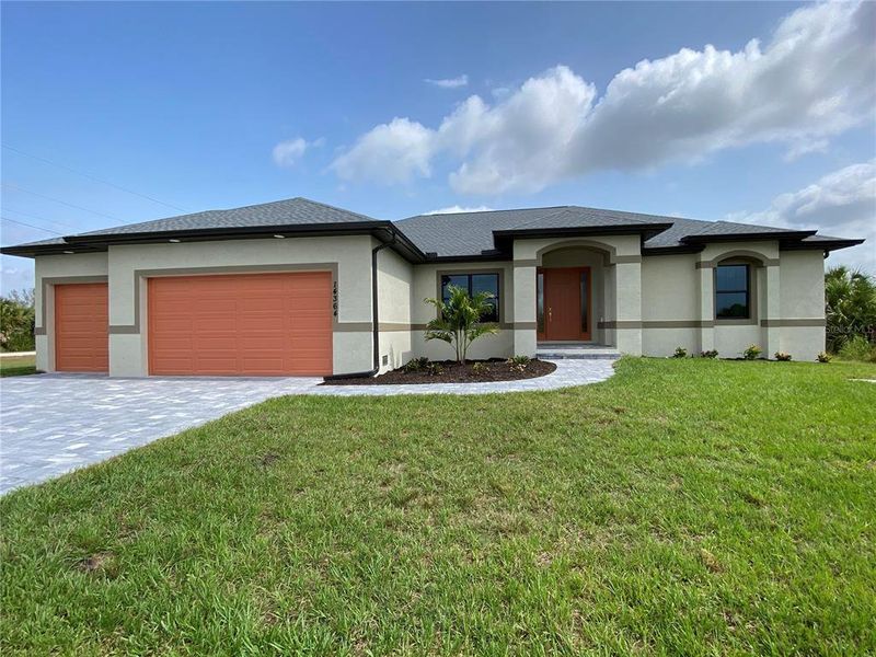 Front exterior of a new home in , Port Charlotte, FL, highlighting curb appeal (Image 1). Front exterior of a new home in , Port Charlotte, FL, highlighting curb appeal (Image 1).