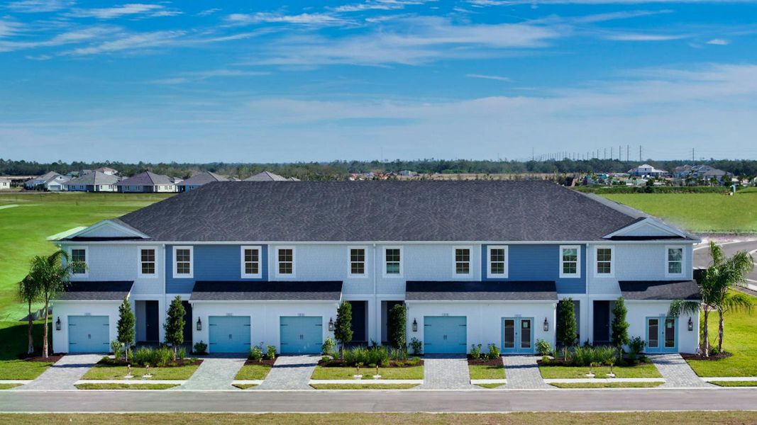 Front exterior of a new home in Palm Grove Real Estate and Homes for Sale in Lakewood Ranch, FL - Neal Communities, Lakewood Ranch, FL, highlighting curb appeal (Image 2).