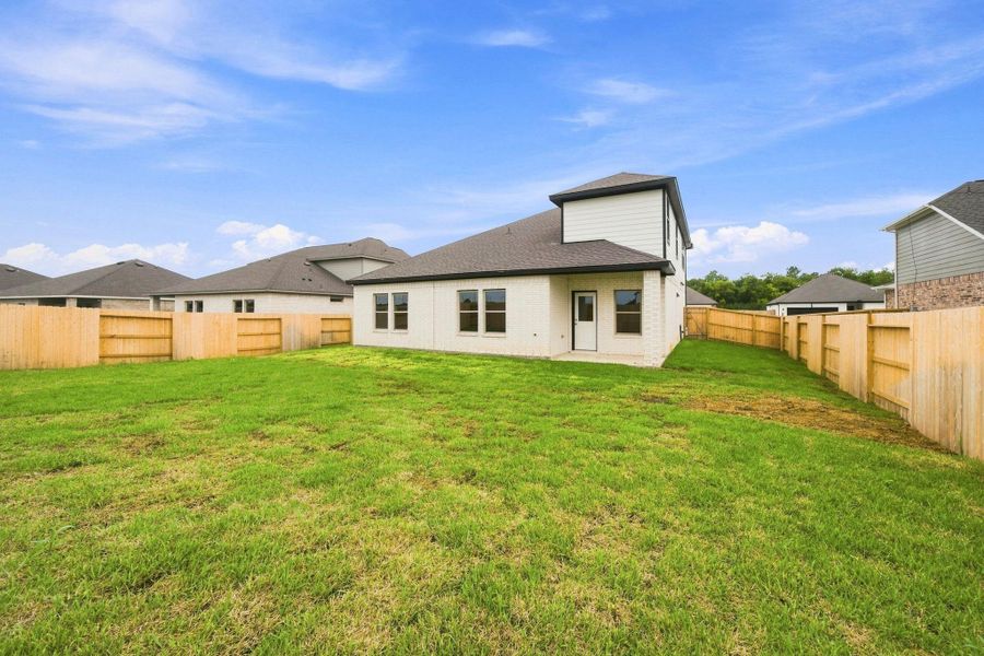 Exterior details and patio area of a home in Windcress, Cove (Image 3).