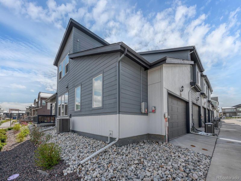 Front exterior of a new home in Green Gables, Denver, CO, highlighting curb appeal (Image 24).