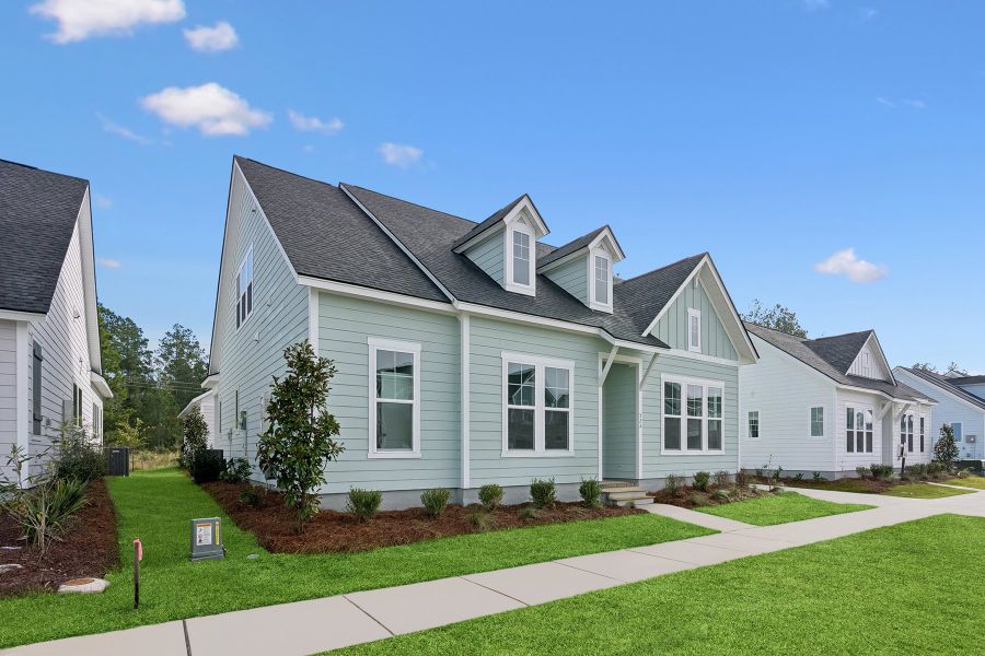 Front exterior of a new home in Nexton – Midtown – The Garden Collection, Summerville, SC, highlighting curb appeal (Image 2). Front exterior of a new home in Nexton – Midtown – The Garden Collection, Summerville, SC, highlighting curb appeal (Image 2).