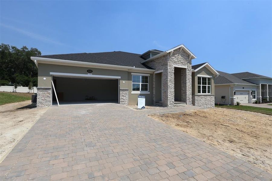 Front exterior of a new home in Wolf Lake Ranch, Apopka, FL, highlighting curb appeal (Image 8).
