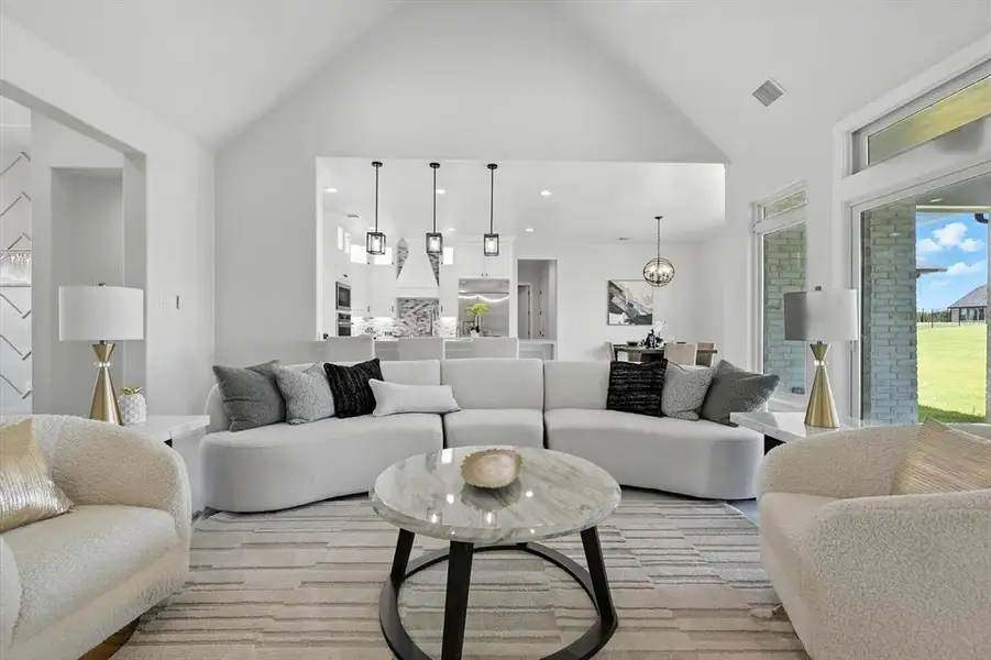 Living area with high vaulted ceiling Living area with high vaulted ceiling