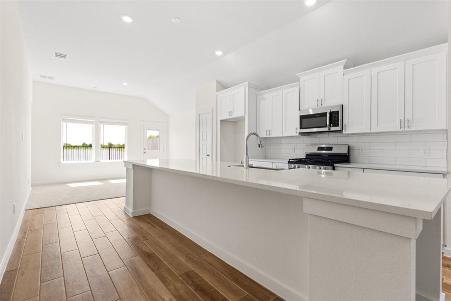 Large kitchen island with builder rated farm sink