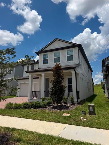 Front exterior of a new home in , Winter Garden, FL, highlighting curb appeal (Image 27).