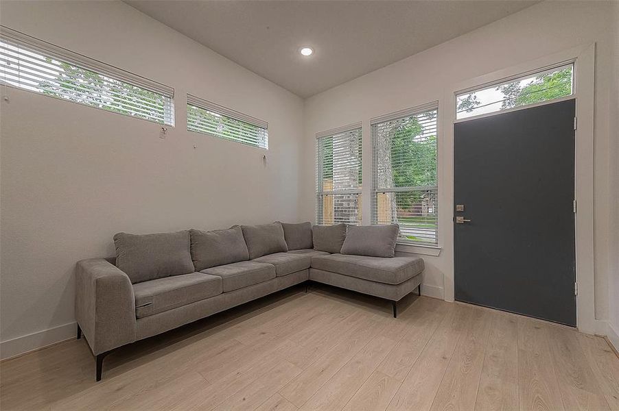 Windows let in a lot of natural light and overlook the front yard with green space. The attention to detail that this home has is not to be missed.