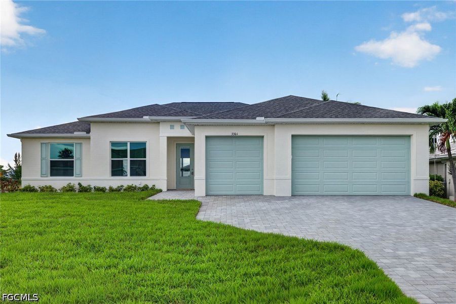 Front exterior of a new home in Cape Coral, Cape Coral, FL, highlighting curb appeal (Image 2). Front exterior of a new home in Cape Coral, Cape Coral, FL, highlighting curb appeal (Image 2).