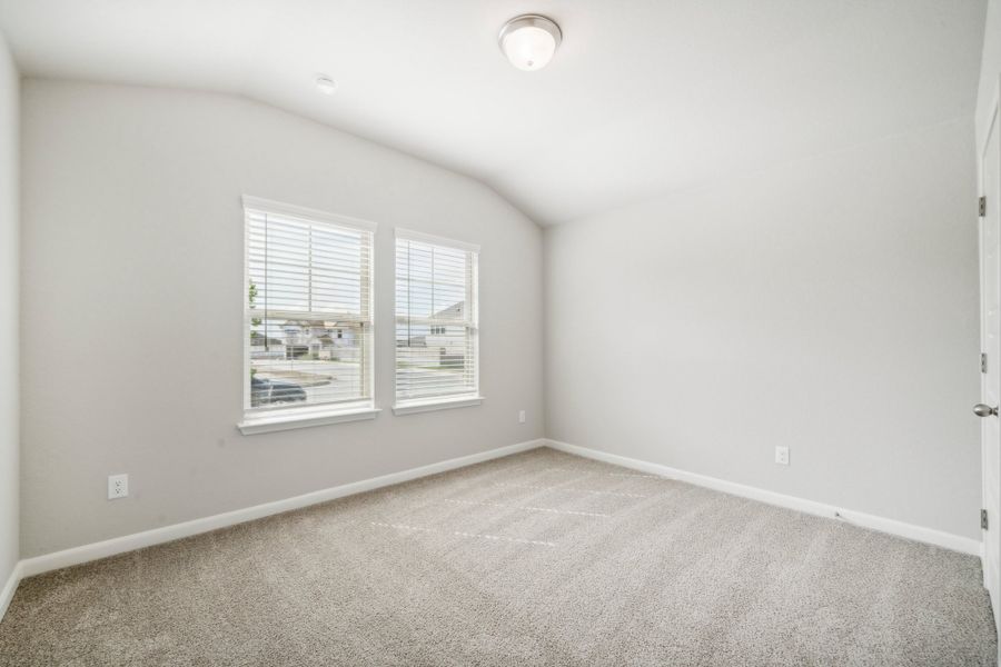 Guest bedroom in the Fitzhugh floorplan in a Meritage Homes community.