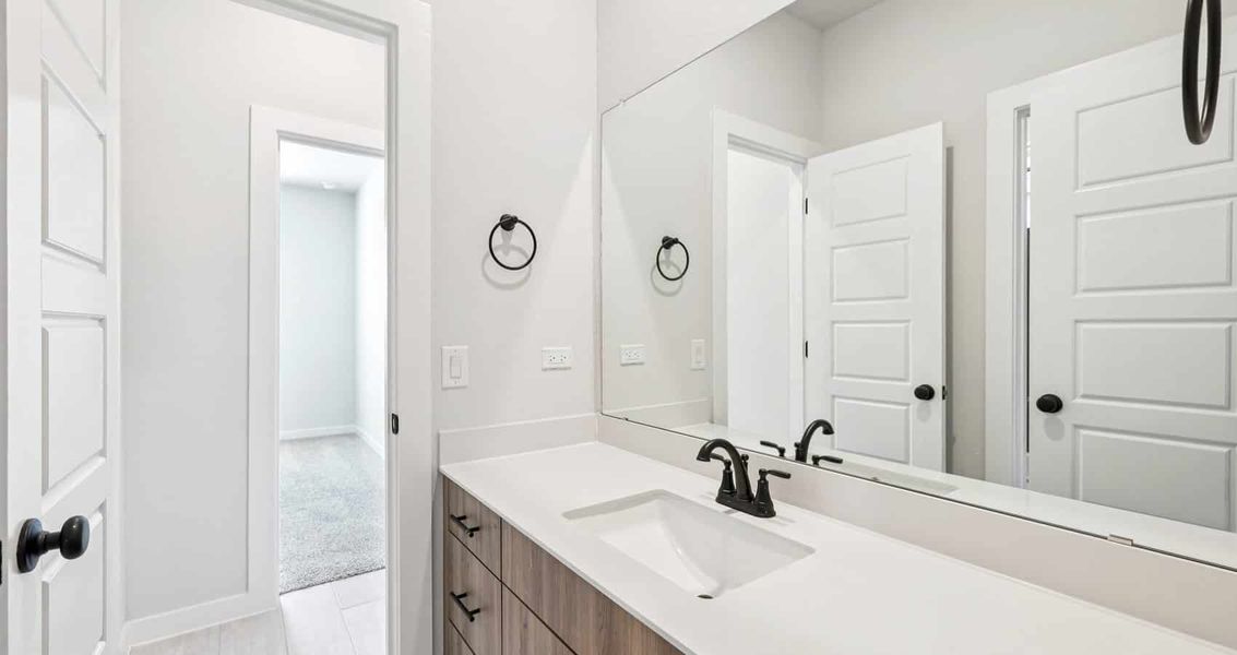 Furnished interior view inside a new home in Trace, San Marcos (Image 15).