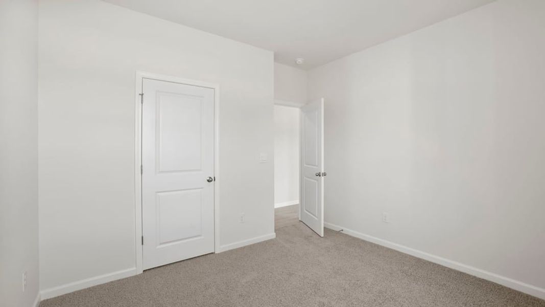 Spacious, unfurnished interior of a new home in Durbin Meadows Traditions, Fountain Inn (Image 24).