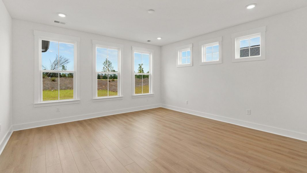 Sunlit primary suite offers a relaxing retreat with space and style at Chestnut Farms.