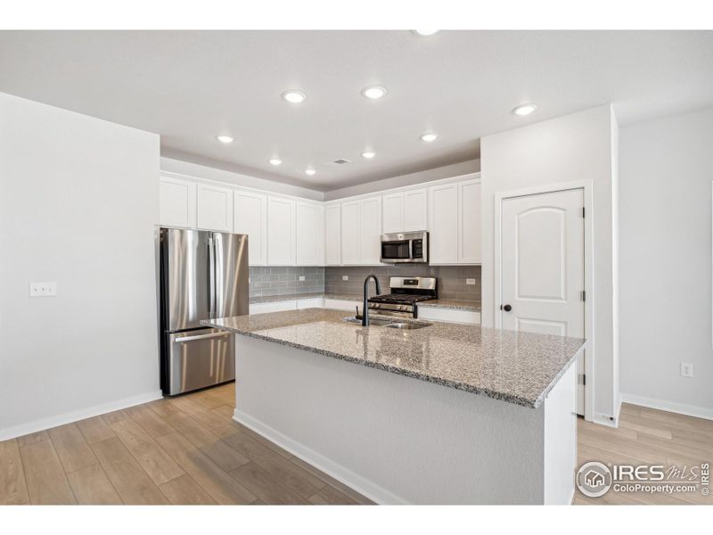 Furnished interior view inside a new home in Kinston Mainstreet Townhomes, Loveland (Image 7).