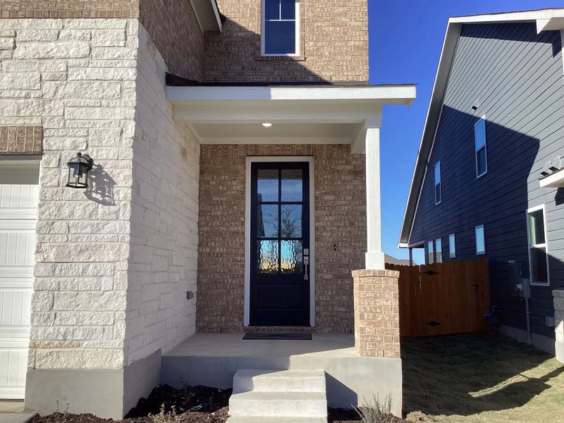 Exterior details and patio area of a home in The Homestead at Lariat, Liberty Hill (Image 3).