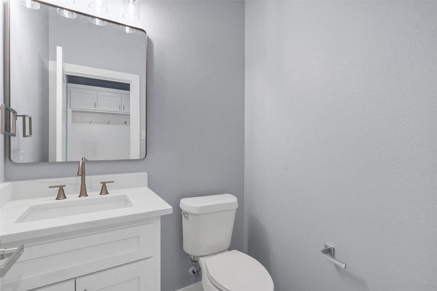 Bathroom featuring toilet and vanity