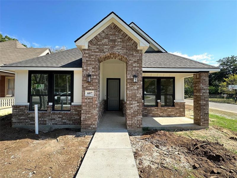 View of front of house with covered porch