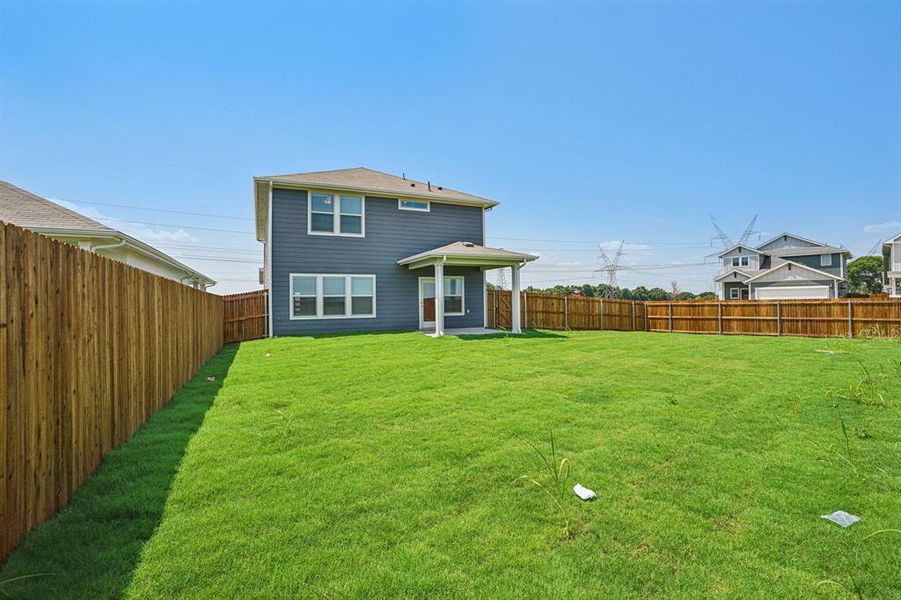 Front exterior of a new home in Trails of Lavon - Spring Series, Lavon, TX, highlighting curb appeal (Image 1).