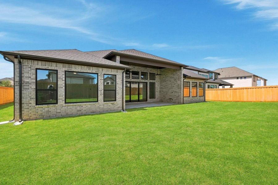 Exterior details and patio area of a home in Dunham Pointe 70', Cypress (Image 3).