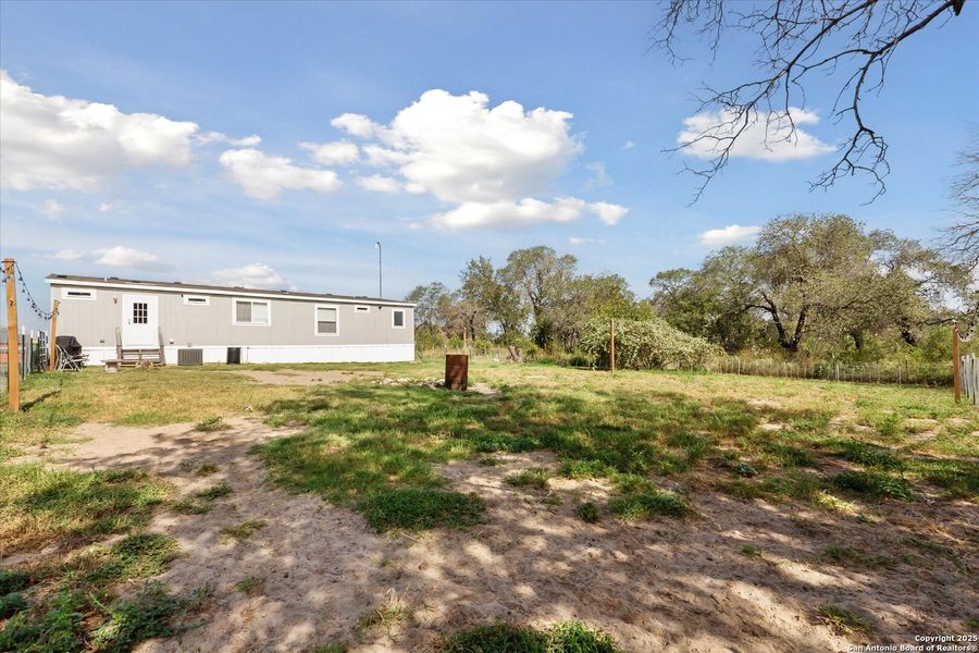 Front exterior of a new home in , Somerset, TX, highlighting curb appeal (Image 19). Front exterior of a new home in , Somerset, TX, highlighting curb appeal (Image 19).