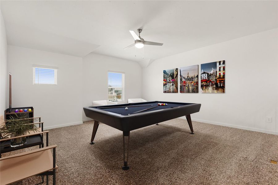 The Game Room features plush carpet, ceiling fan and windows that brighten the space. *Virtually Staged