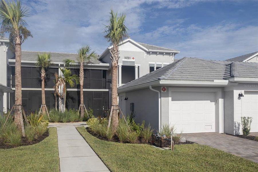 Front exterior of a new home in , Punta Gorda, FL, highlighting curb appeal (Image 2).