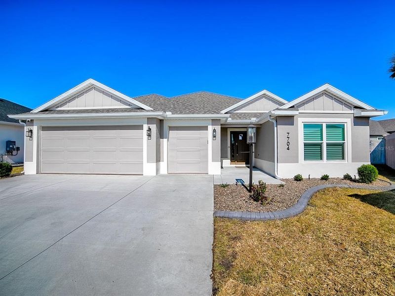 Front exterior of a new home in , The Villages, FL, highlighting curb appeal (Image 25). Front exterior of a new home in , The Villages, FL, highlighting curb appeal (Image 25).