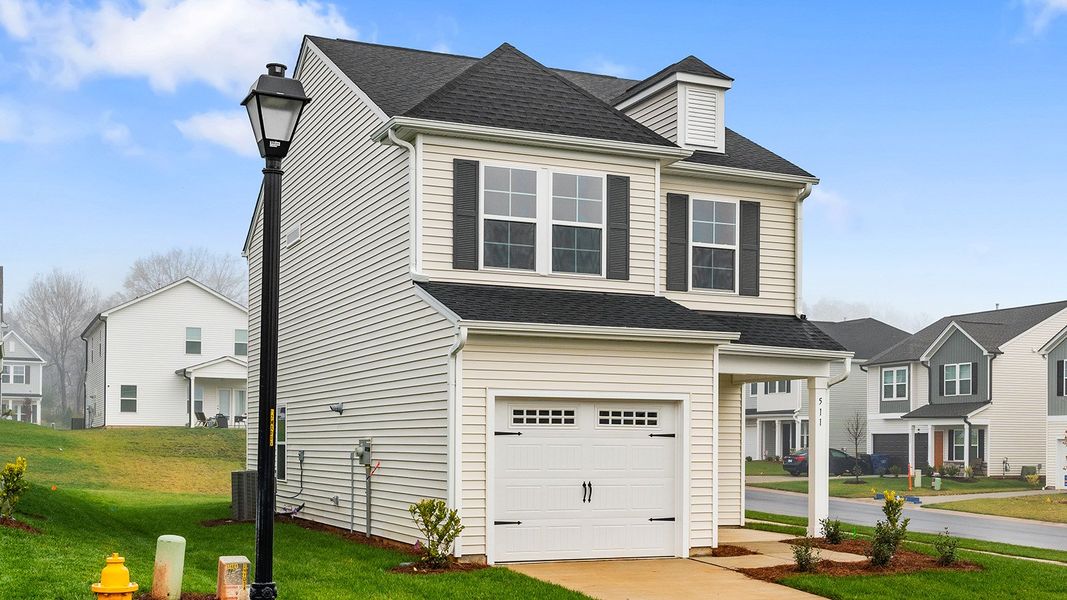 Front exterior of a new home in Hanes Lake, Winston-Salem, NC, highlighting curb appeal (Image 19).