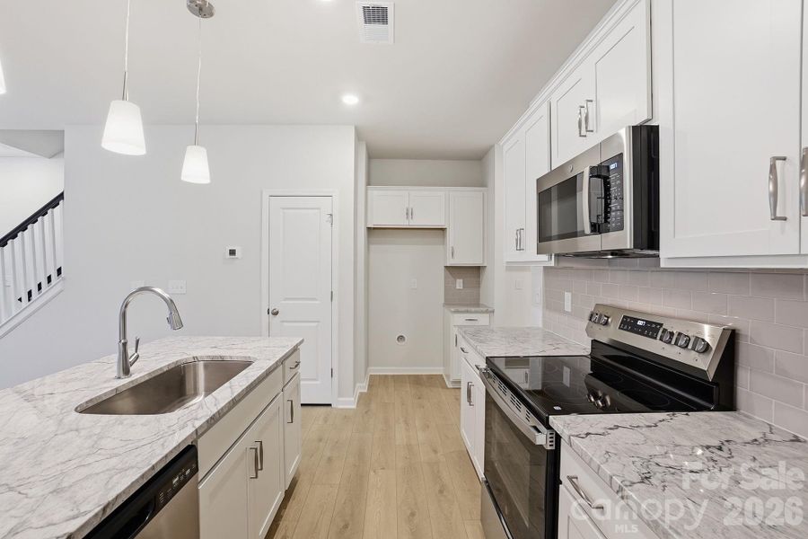 Furnished interior view inside a new home in Sloan Station, Charlotte (Image 8).