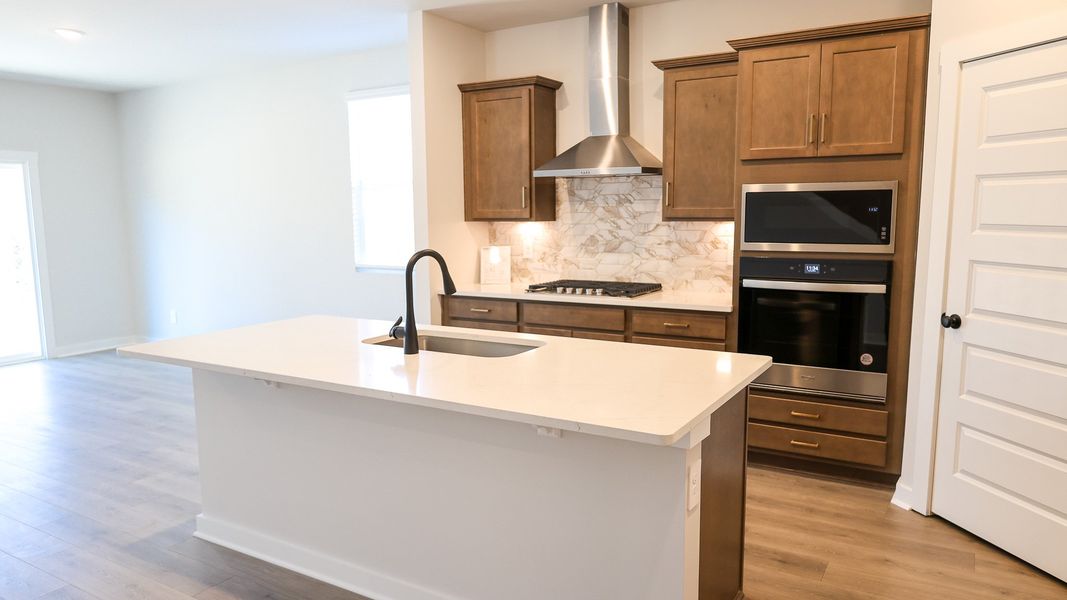 Representative furnished interior of a home built from the EMBRY by D.R. Horton in Harvest Point, Spring Hill (Image 6).
