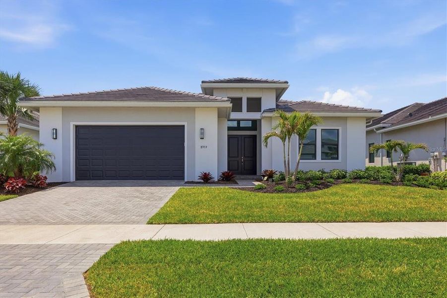 Front exterior of a new home in , Sarasota, FL, highlighting curb appeal (Image 27).