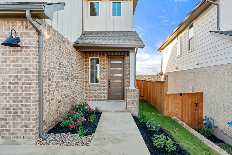 Exterior details and patio area of a home in Terrace Collection at Lariat, Liberty Hill (Image 3).