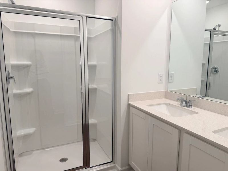 Primary Bath - Clean geometry and high-contrast finishes. Primary Bath - Clean geometry and high-contrast finishes.