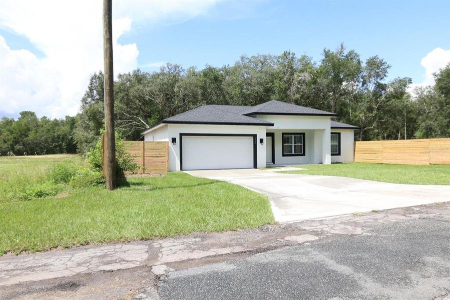 Front exterior of a new home in , Dunnellon, FL, highlighting curb appeal (Image 2). Front exterior of a new home in , Dunnellon, FL, highlighting curb appeal (Image 2).