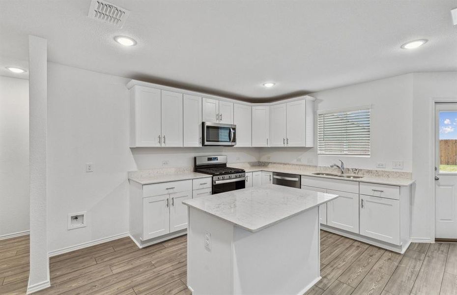 *Model representation. Some features and options may differ - Spacious kitchen with eat-in bartop island *Model representation. Some features and options may differ - Spacious kitchen with eat-in bartop island