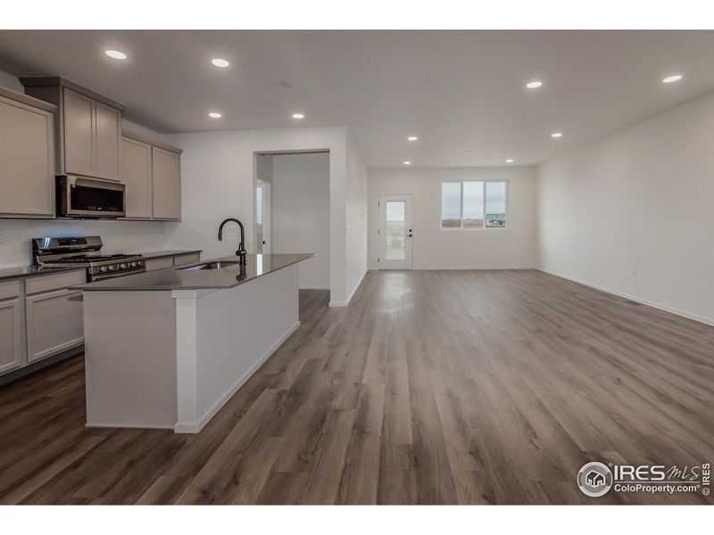 KITCHEN OPEN TO DINING AND LIVING ROOM