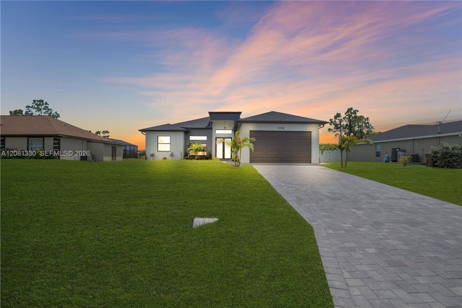 Front exterior of a new home in , Cape Coral, FL, highlighting curb appeal (Image 2). Front exterior of a new home in , Cape Coral, FL, highlighting curb appeal (Image 2).
