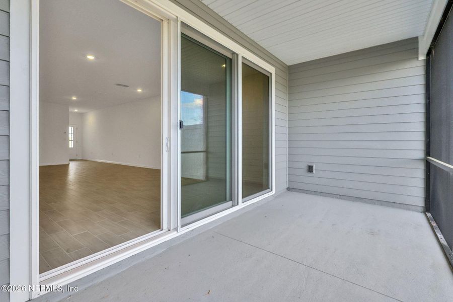 Exterior details and patio area of a home in Cherry Elm at SilverLeaf, St. Augustine (Image 26).